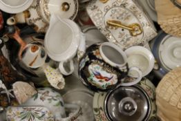 A large collection of vintage porcelain teapots.