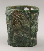 A carved jade brush pot. 15.5 cm high.