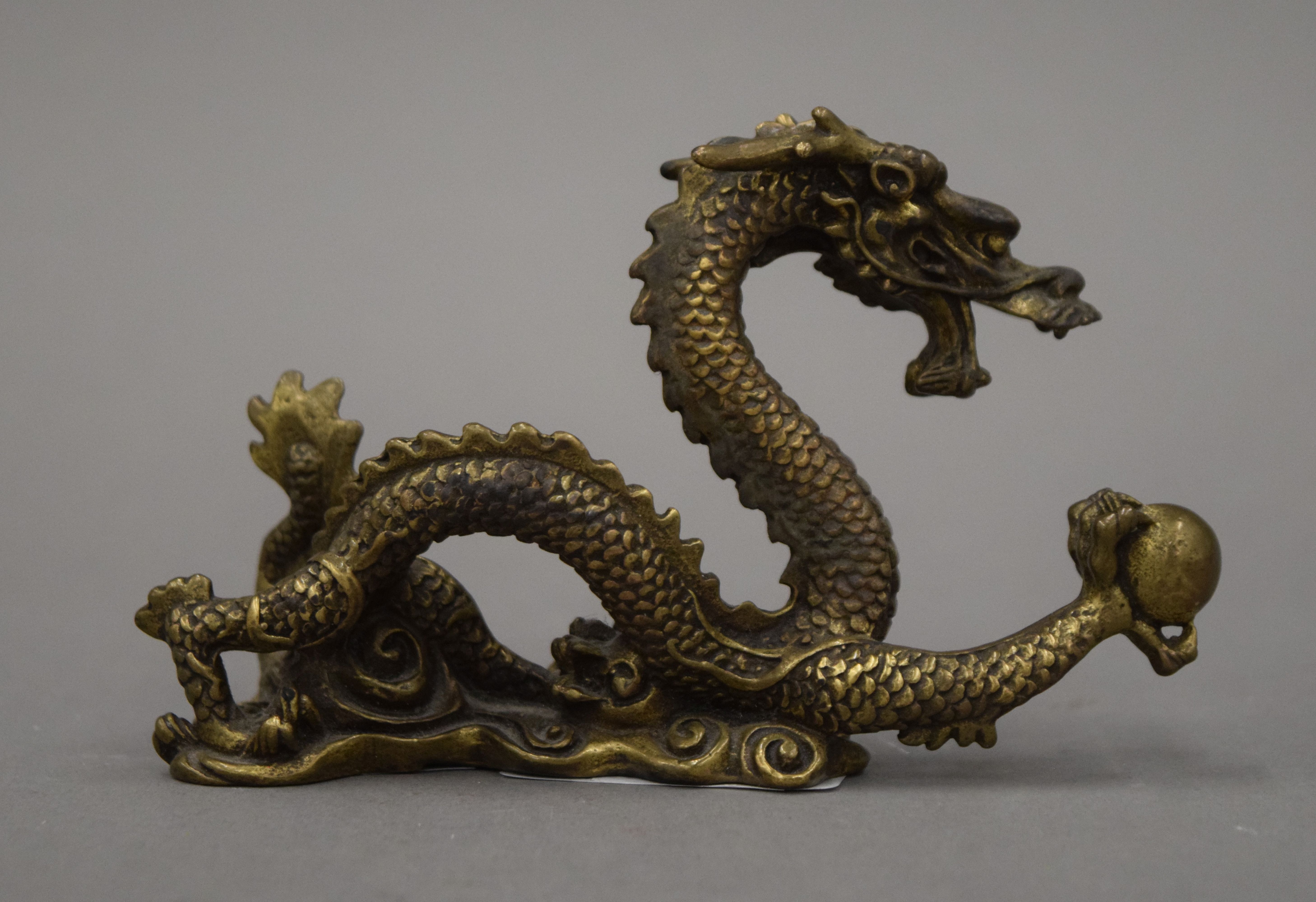 A Chinese gilt bronze dragon brush rest. 7 cm high. - Image 3 of 3