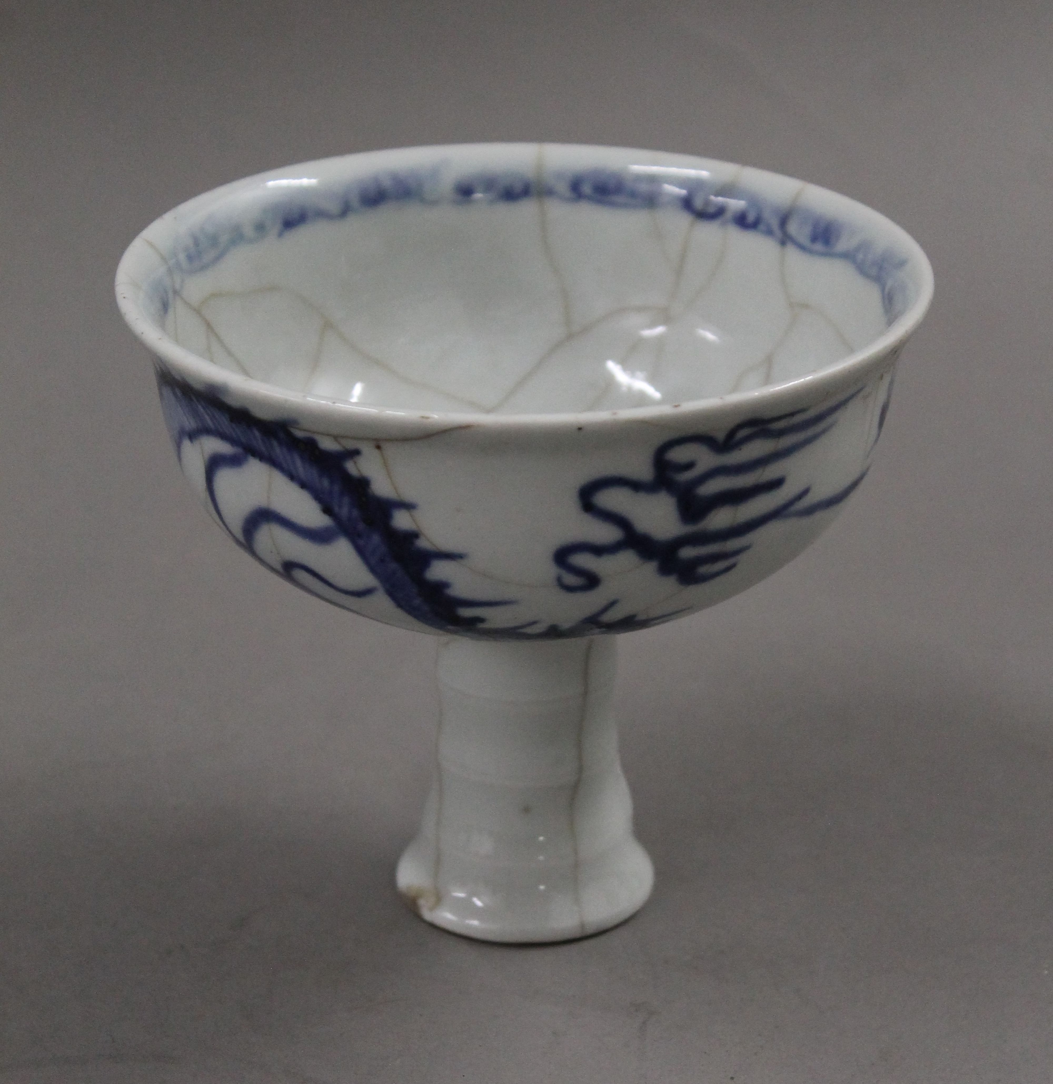 A Chinese blue and white porcelain stem cup. 11 cm high.
