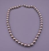 A ladies Tiffany silver bubble necklace, with UK Tiffany hallmarks on chain. 44 cm long. 47.