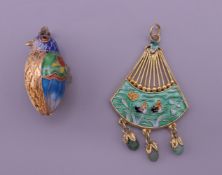 Two Chinese silver gilt enamel pendants. The largest 4 cm high.