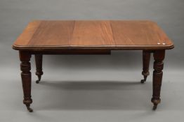 A Victorian mahogany one leaf wind out dining table. 142 cm long extended, 103 cm wide.