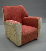 A mid 20th century upholstered child's chair. 54 cm wide.