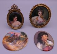 Four 19th century painted porcelain plaques, two with brass frames. The largest 7 cm high.