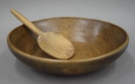 A 19th century dairy bowl and spoon. The former 35.5 cm wide.