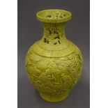 A Chinese olive green vase of reticulated form with Qianlong seal mark to base and decorated with