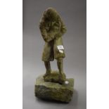 An unusual sculpture of a man holding a baby mounted on a granite base. 38 cm high.