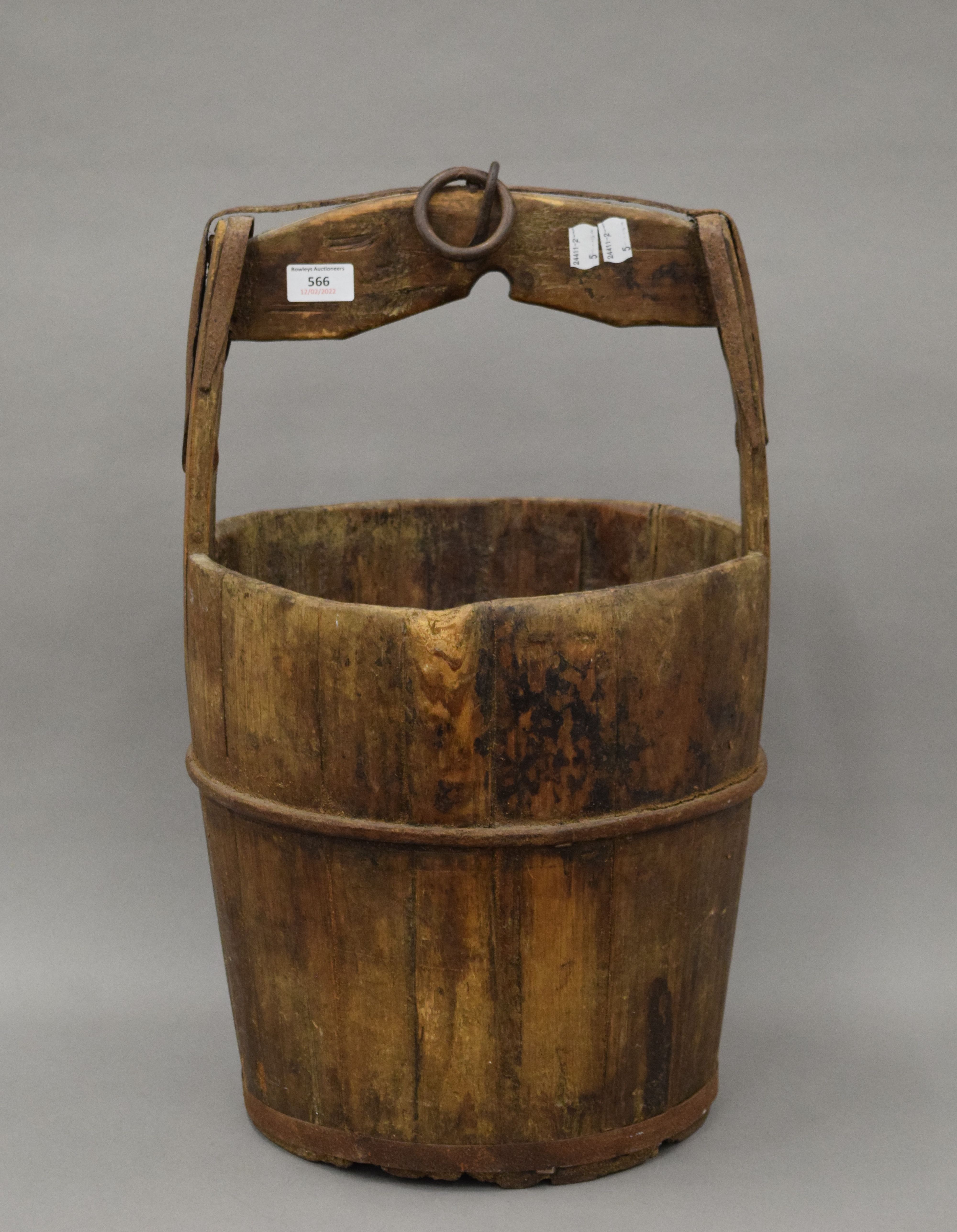 An antique Chinese wooden well bucket. 56 cm high.