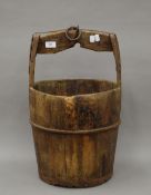 An antique Chinese wooden well bucket. 56 cm high.