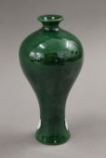 A small Chinese green porcelain vase. 15.5 cm high.