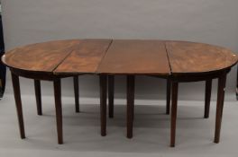 A 19th century mahogany d-end dining table with associated leaves. 194 cm long including leaves.