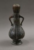 A Chinese archaic type onion top bronze vase. 28.5 cm high.