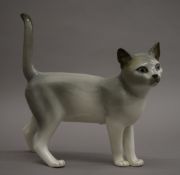 A Royal Dux porcelain model of a cat. 27 cm high.