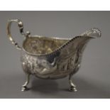 An embossed Irish silver sauce boat. 15.5 cm long. 145.3 grammes.