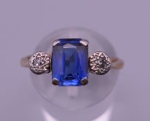 An 18 ct gold diamond and rectangular sapphire ring. Ring size P/Q.