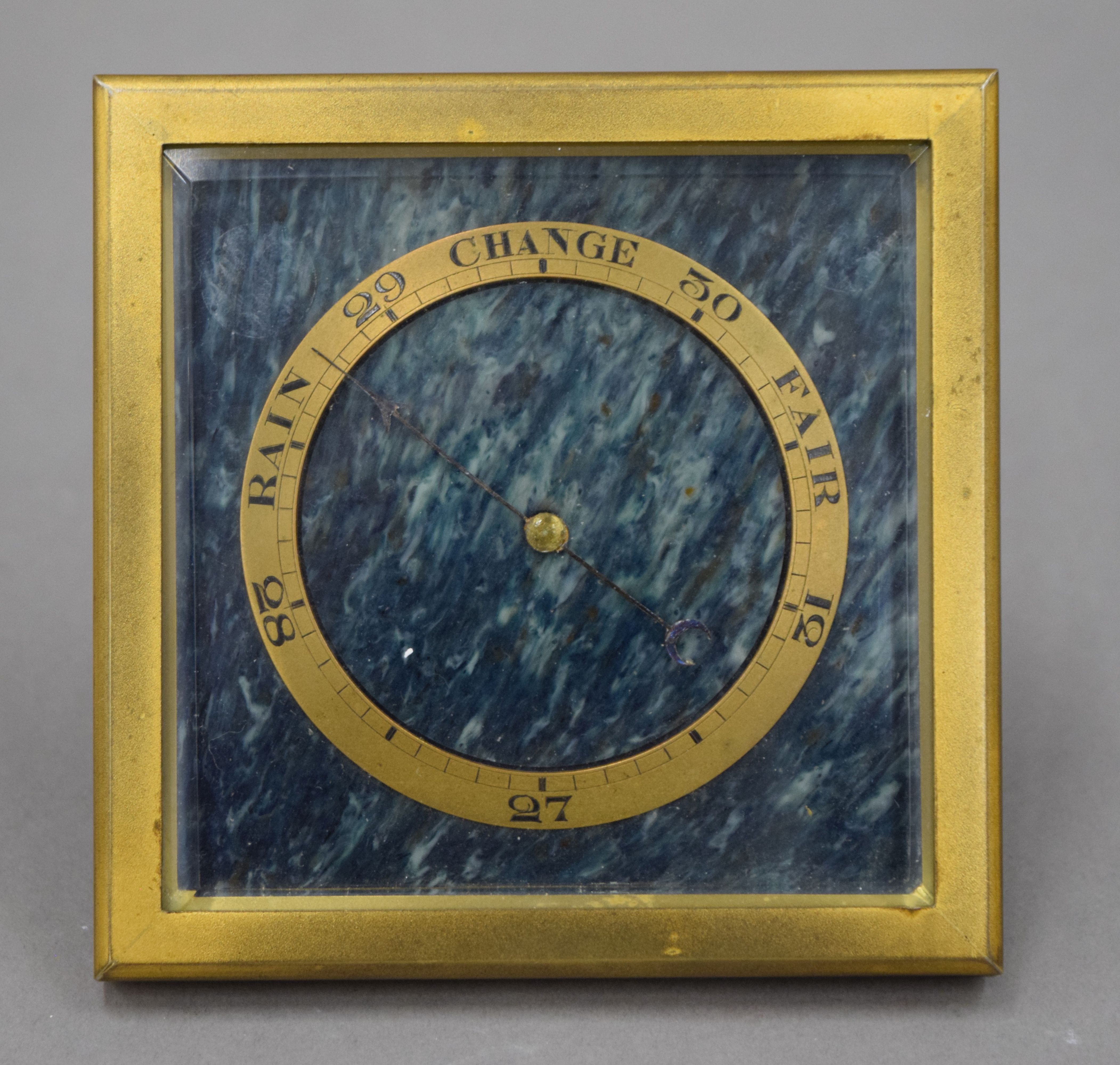 A Goldsmith and Silversmith London desk barometer. 10 cm square.