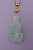 A gold mounted jade Guanyin pendant. 5 cm high.