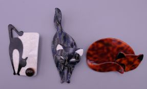 Three Lea Stein brooches.