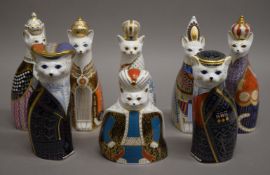 Eight Royal Crown Derby Royal cat paperweights. The largest 22 cm high.