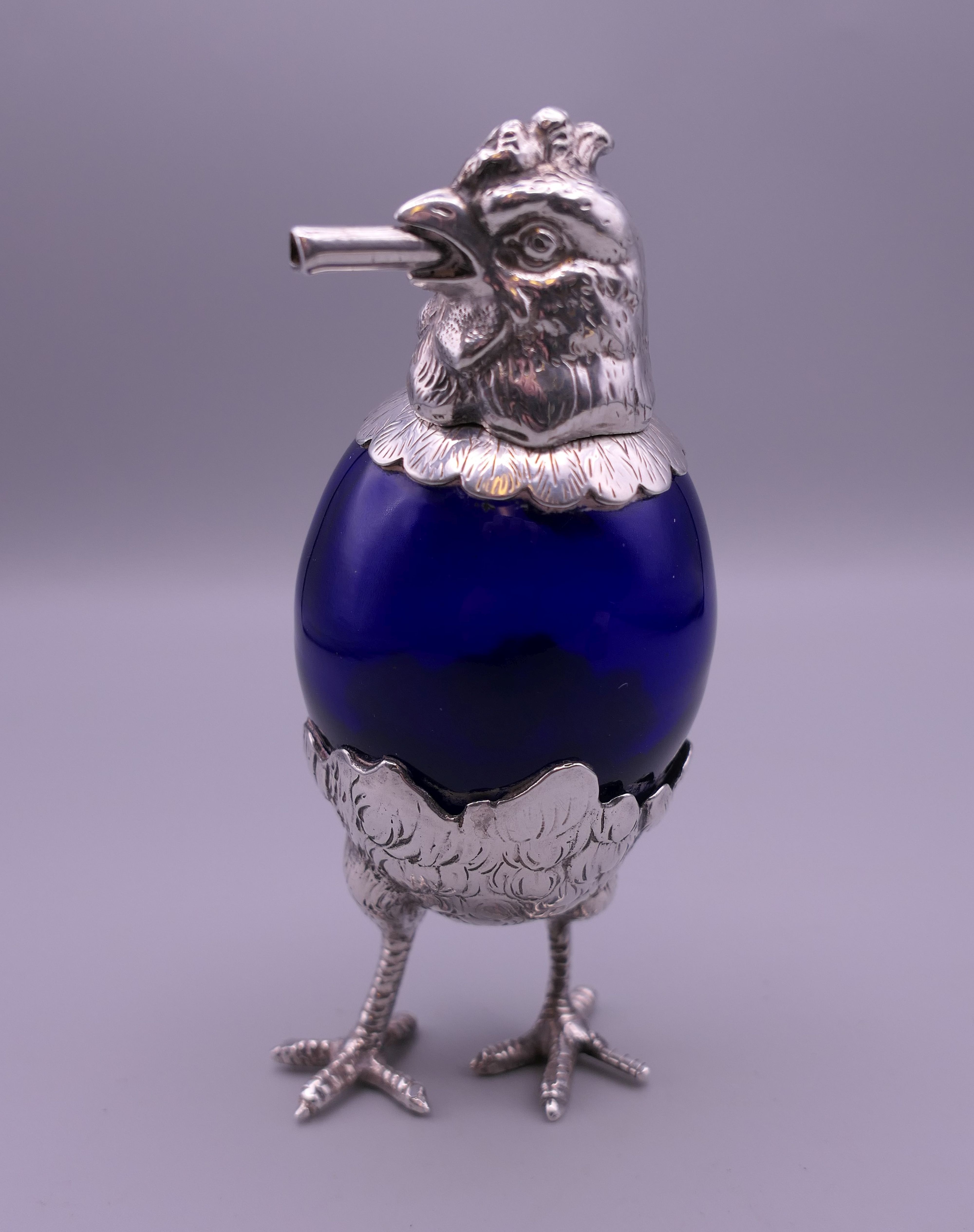 A Continental table lighter formed as a chicken.