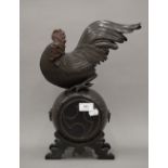 A large Meiji Period Japanese bronze model of a chicken on a barrel. 38 cm high.