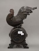 A large Meiji Period Japanese bronze model of a chicken on a barrel. 38 cm high.