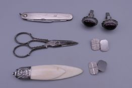 A silver penknife, two silver cufflinks, scissors stamped for Asprey, book maker, etc.