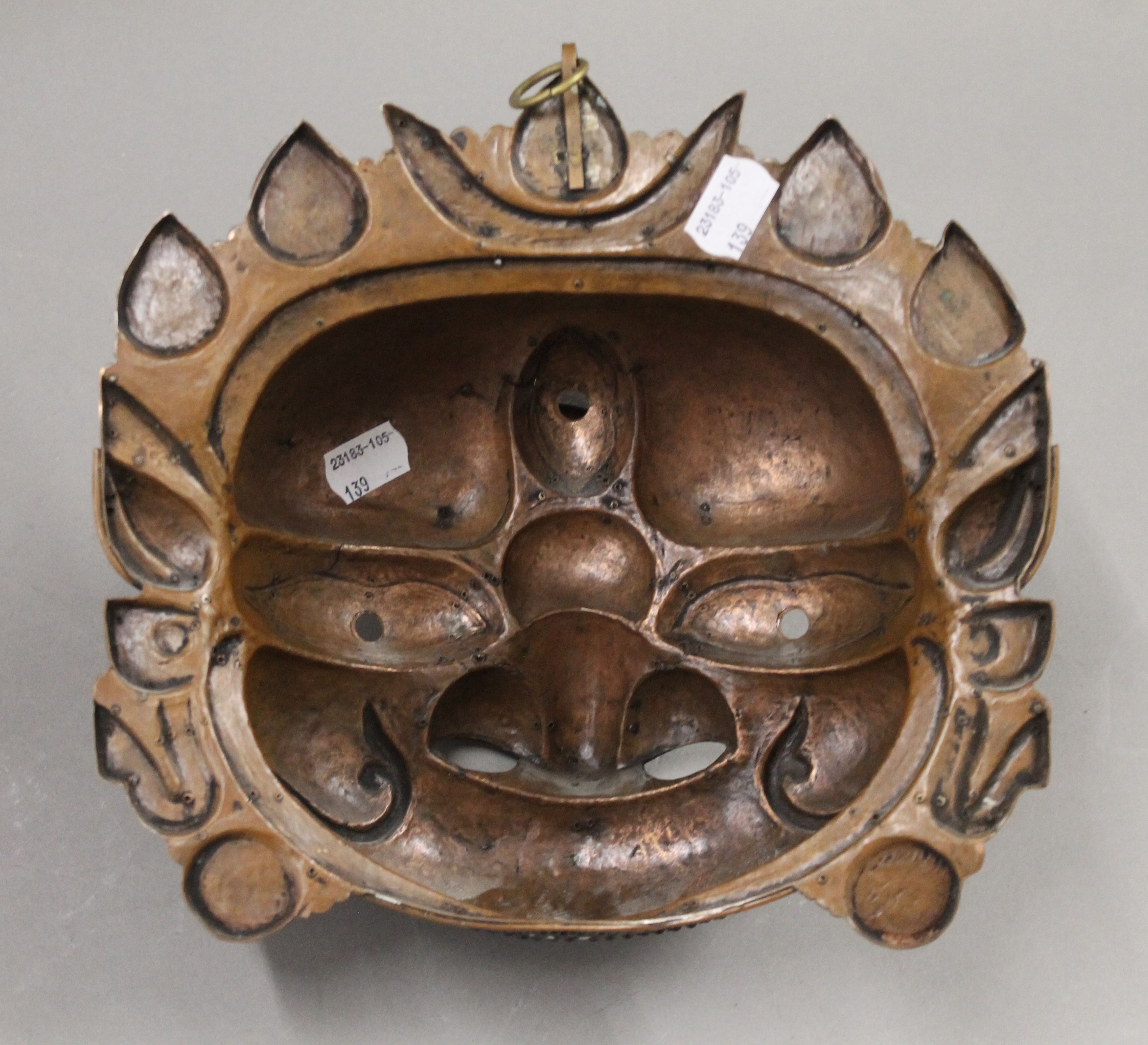 A Tibetan cabochon set copper and brass mask. 23 cm wide. - Image 3 of 5