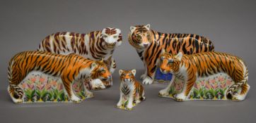 Five Royal Crown Derby tiger paperweights. The largest 13 cm high.