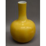 A 19th century Chinese yellow ground vase on a carved wooden stand,