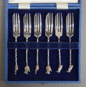 A cased set of cake forks, each finial with an Australian animal.