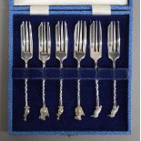 A cased set of cake forks, each finial with an Australian animal.