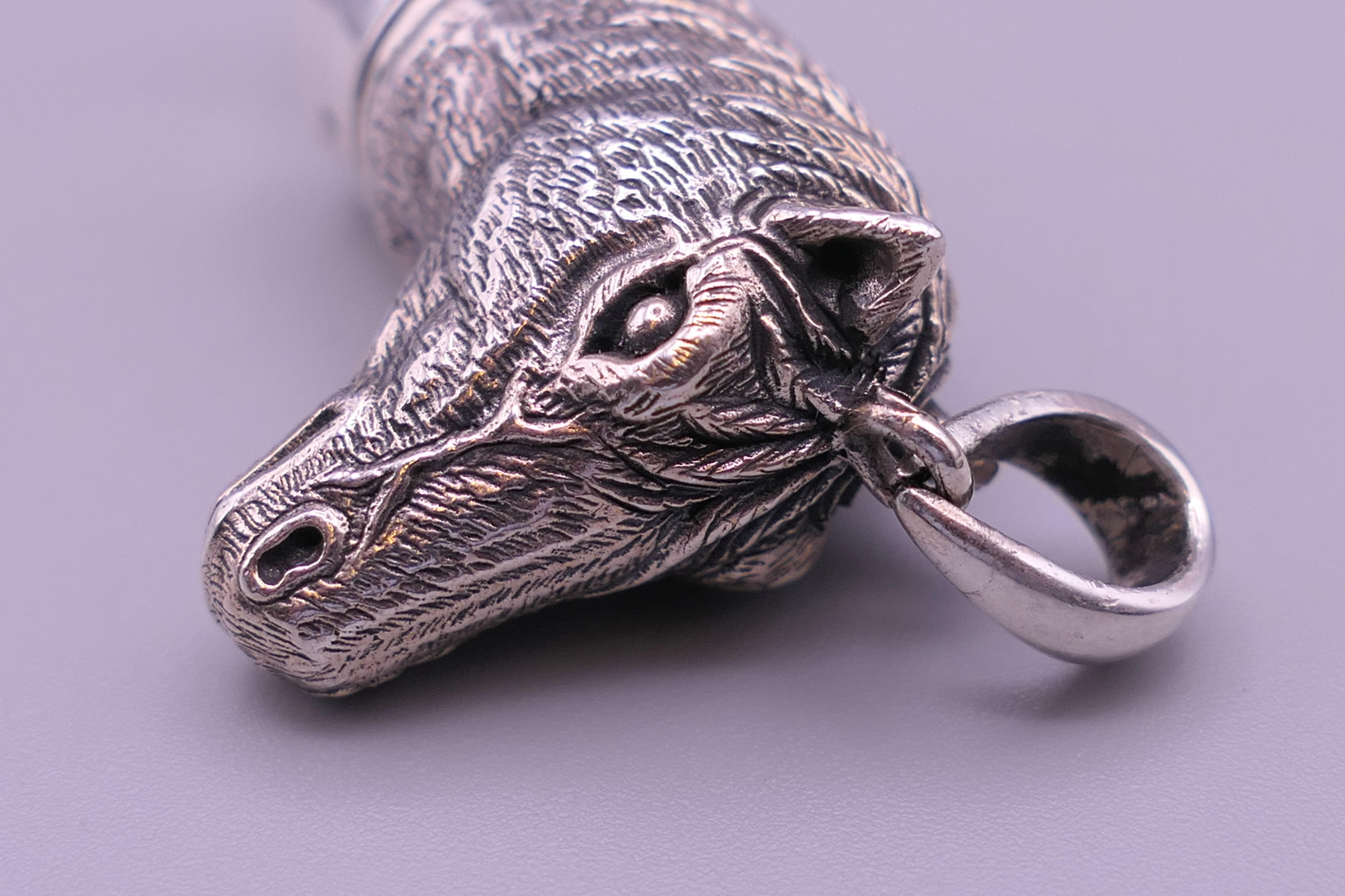 A 925 silver whistle in the form of a horse's head. 4 cm high excluding suspension loop. - Image 6 of 6