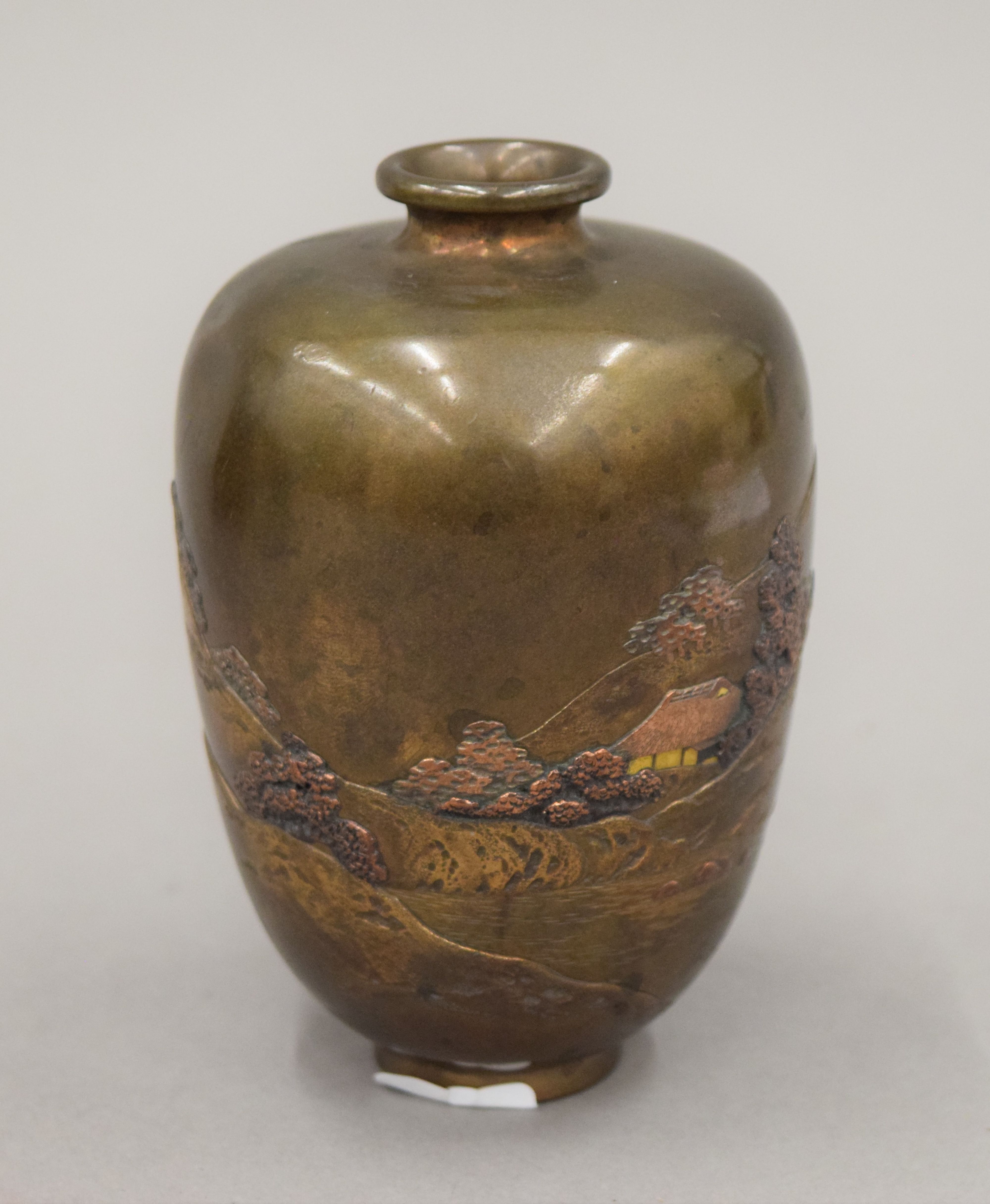 A Meiji Period Japanese gold inlaid bronze vase. 11 cm high.