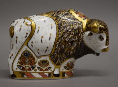 A Royal Crown Derby limited edition North American bison paperweight with gold mark. 11 cm high.