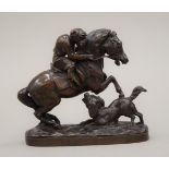 A 19th century bronze model of a monkey riding a horse, indistinctly signed. 10 cm high.