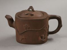 A Chinese Yixing pottery teapot. 18.5 cm long.