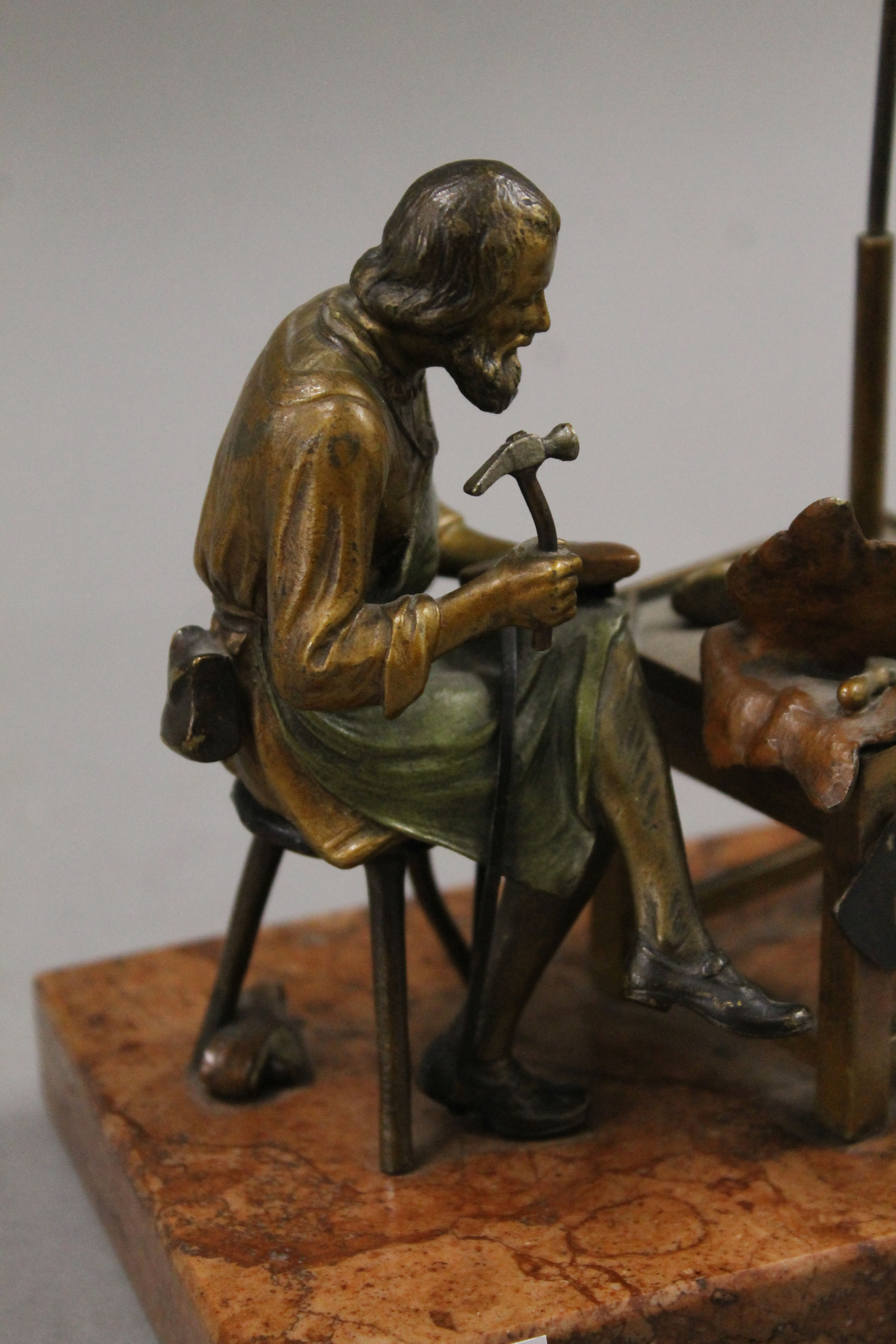 A cold painted bronze model of a cobbler mounted on a rouge marble base. 13.5 cm wide. - Image 5 of 6