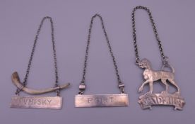 Three 19th century decanter labels, for Port, Madeira and Whisky, one formed as a dog.
