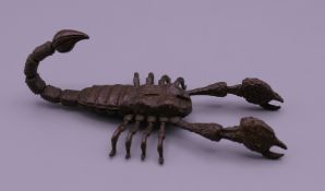A bronze articulated scorpion. 9 cm long.