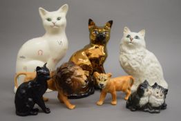 A collection of Beswick cats and lions. The largest 28.5 cm high.