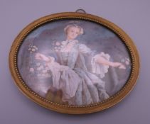 A 19th century miniature portrait of a young flower girl, framed. 11 cm wide overall.