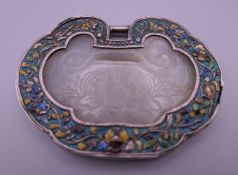 A Chinese unmarked silver enamel and jade buckle. 8 cm wide.