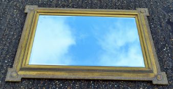 A gilt framed bevelled mirror. 119 x 88 cm.