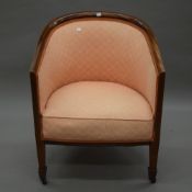 An Edwardian mahogany framed upholstered tub chair. 61.5 cm wide.