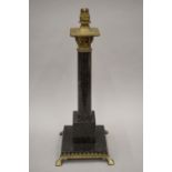 An early 20th century Arts and Crafts marble and brass decorated table lamp. 51 cm high.