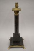 An early 20th century Arts and Crafts marble and brass decorated table lamp. 51 cm high.