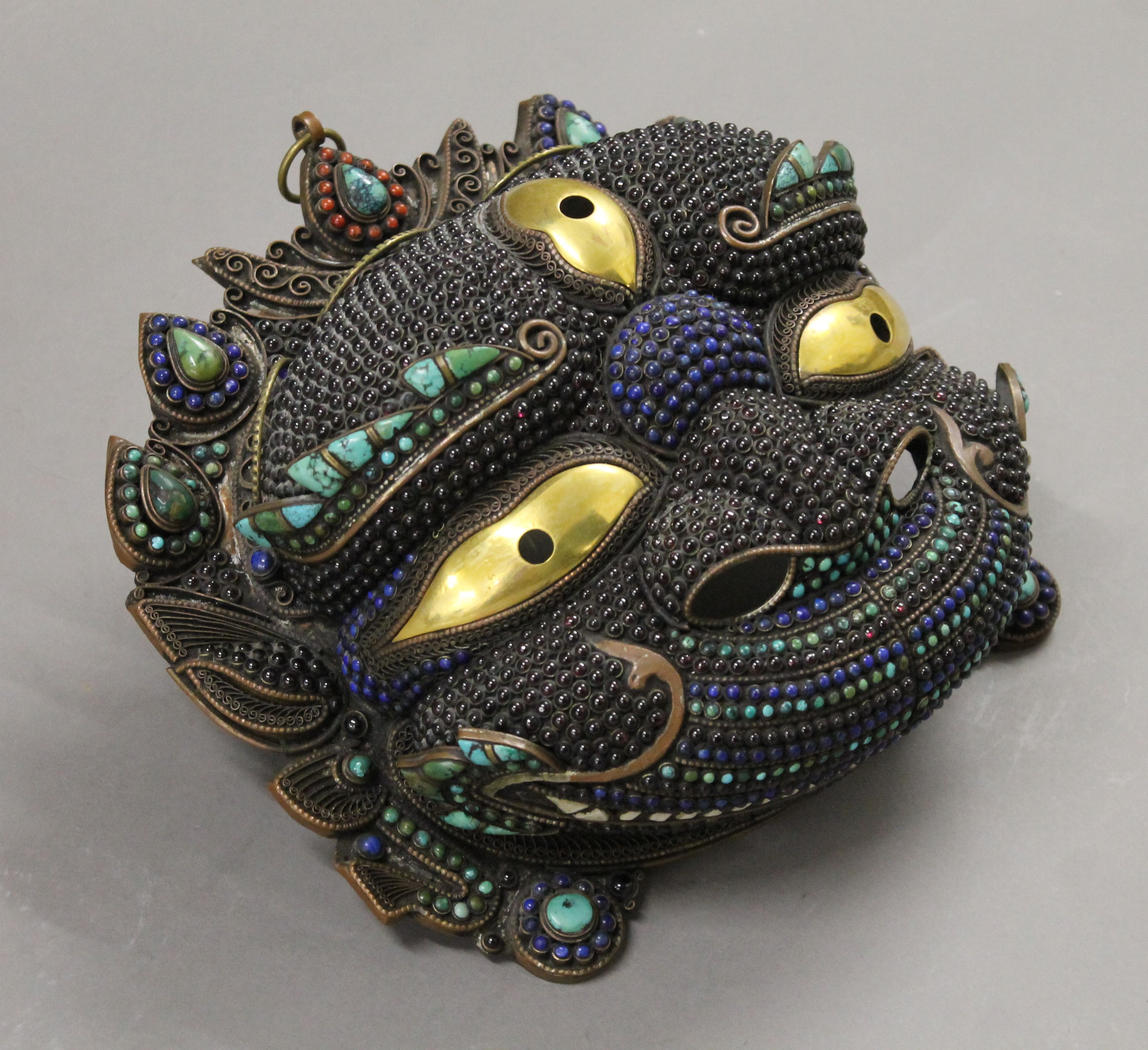 A Tibetan cabochon set copper and brass mask. 23 cm wide. - Image 2 of 5