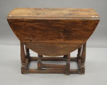An 18th century and later oak gate leg table. 103 cm long.